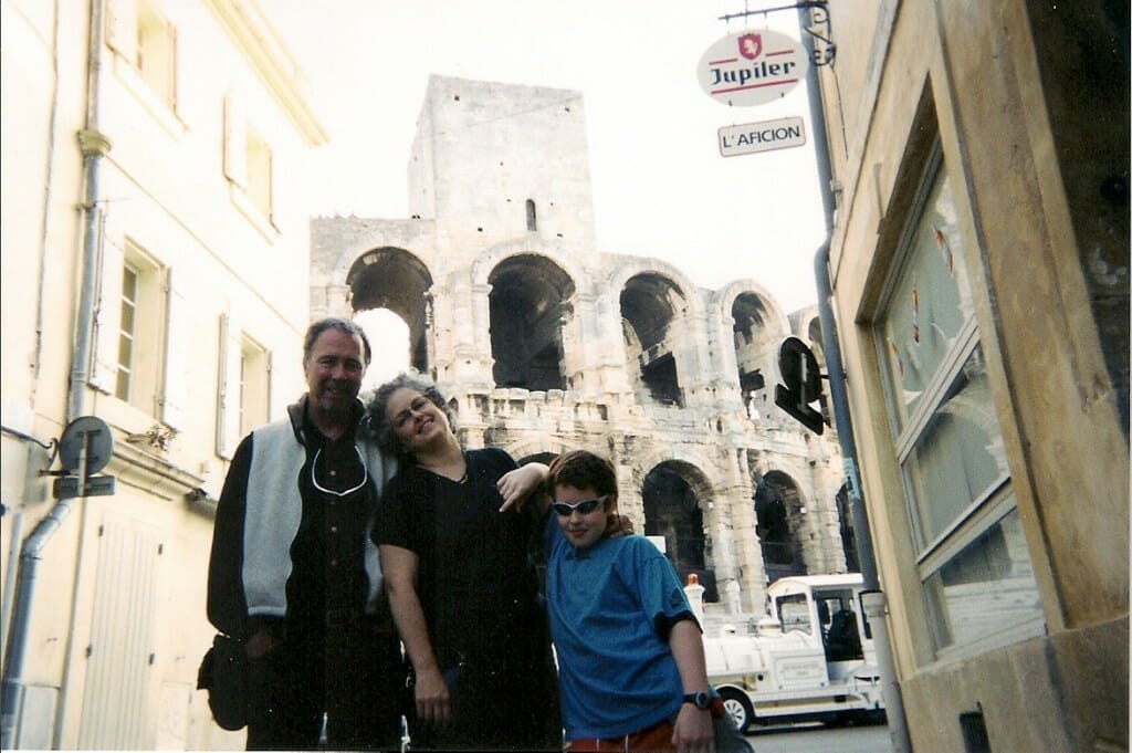 Colisseum in Arles behind 3 people